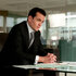Harvey Spector (Gabriel Macht) sits at a desk in a scene from Suits