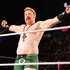 Sheamus outstretches his arms while standing in the ring