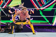 Logan Paul squatting in the ring
