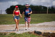 Kacie and Cole take a walk while wearing American flag apparel