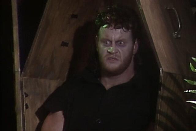 Undertaker standing in a coffin