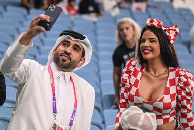 Ivana Knöll, a model from Croatia, poses in the stands before the match