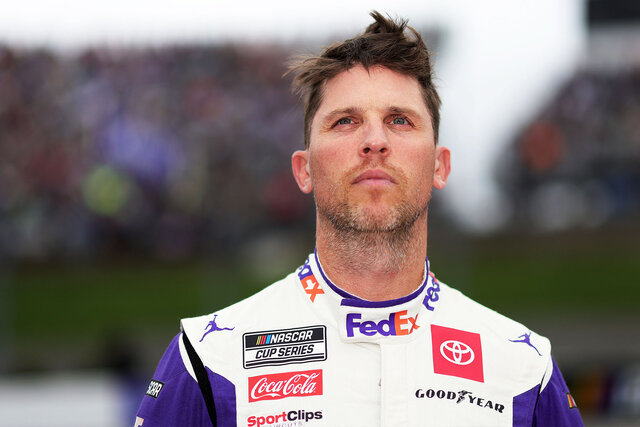 Denny Hamlin looks out into the crowd at a race