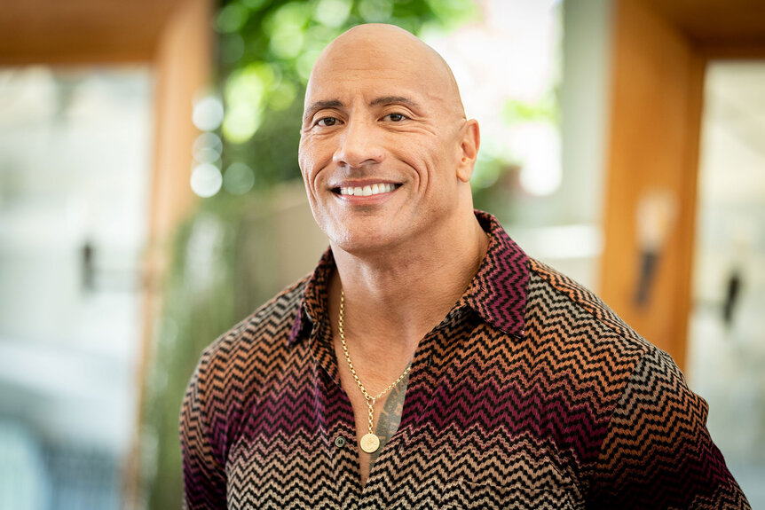 The Rock smiling at the camera