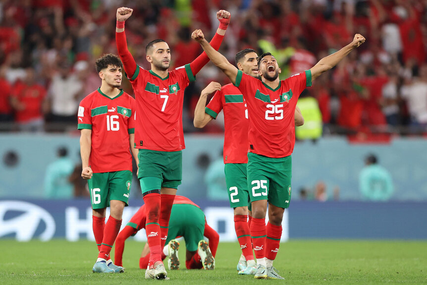 Hakim Ziyech and Yahya Attiat-Allah of Morocco celebrate during the penalty shootout in the FIFA World Cup Qatar 2022 Round of 16 match between Morocco and Spain