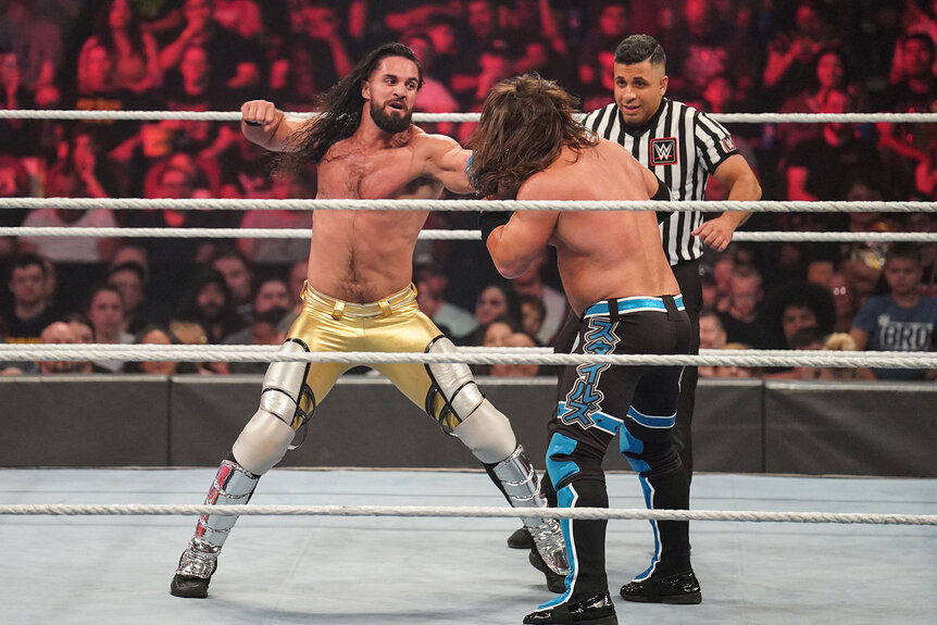 Seth Rollins and AJ Styles fight.