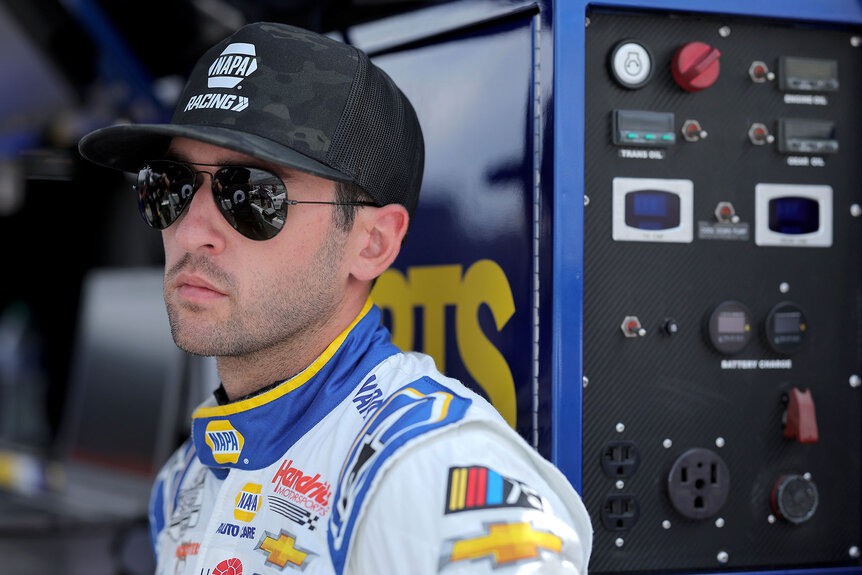 Chase Elliot wears a pair of dark sunglasses before a race