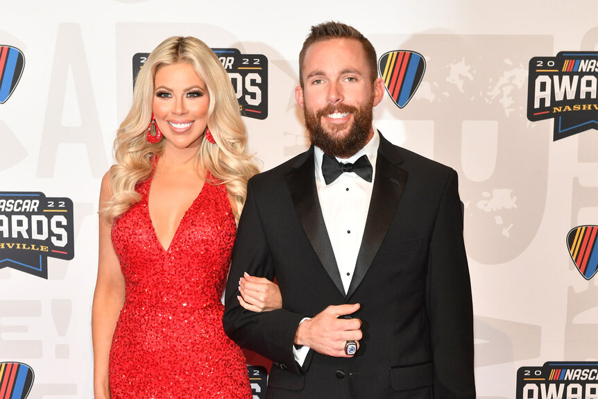 Ross Chastain posing on the red carpet with his girlfriend Erika Turner