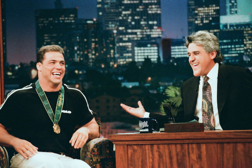 Kurt Angle laughs while being interviewed by Jay Leno on The Tonight Show