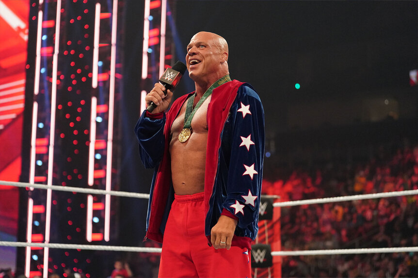 Kurt Angle speaks in the middle of the ring.