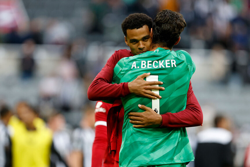 Cody Gakpo of Liverpool and Alisson Becker, goalkeeper of Liverpool hug