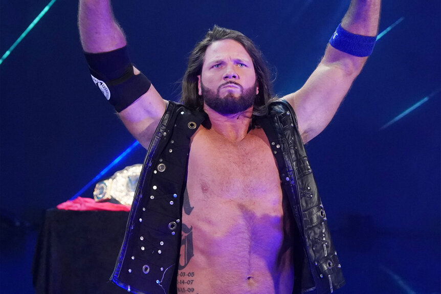 AJ Styles poses outside of the ring
