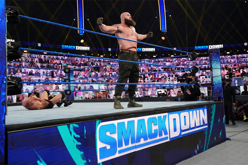 A wrestler stands on the edge of the Smackdown ring