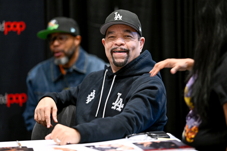 Ice T Wearing a black sweatshirt while sitting on a comic con panel in NYC.