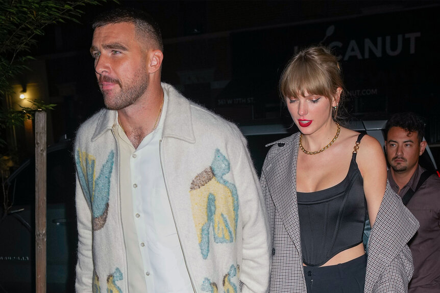 Travis Kelce and Taylor Swift walking down the street in NYC