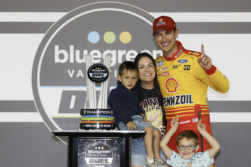 Joey Logano poses with wife Brittany and two sons