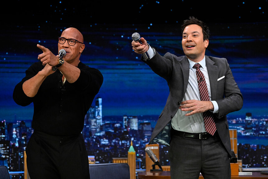 Dwayne The Rock Johnson and Jimmy Fallon point at the crowd