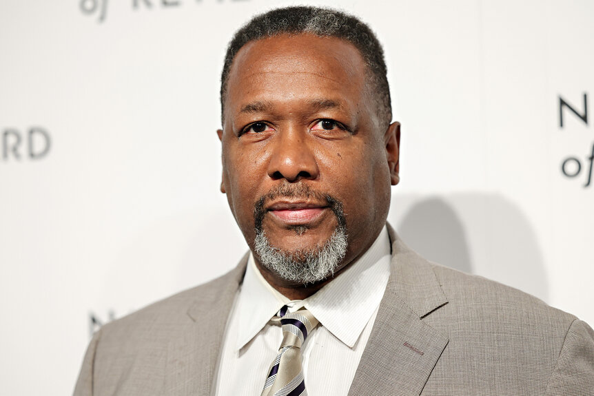 Wendell Pierce wears a grey suit on the red carpet for the 2024 National Board of Review Gala
