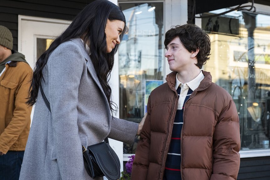 Kate Hawthorne (Meredith Garretson) caresses Max Hawthorne's (Judah Prehn) arm on Resident Alien Episode 404.