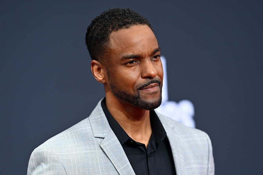 Ronnie Rowe Jr posing on a black background