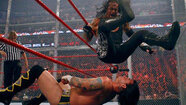 The Undertaker sitting on CMPunk in their 2005 Hell in a Cell match
