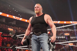 Brock Lesnar standing outside of the ring